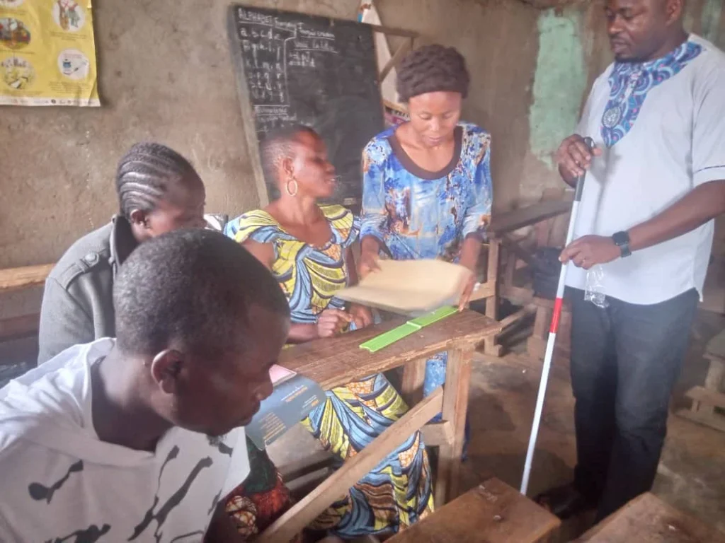 Blind people are learning in a Braille course at the AHAB project in Butembo