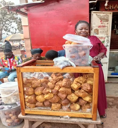 A participant in the AHAB project sells homemade buns herself